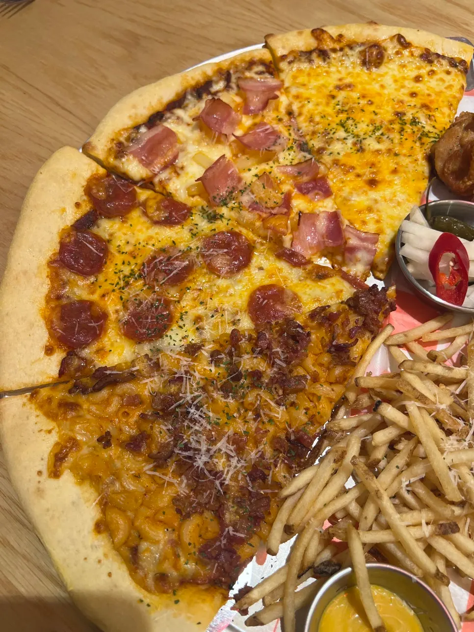 Four slices of pizza, each a different flavor