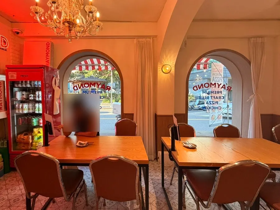 Tables seating 2–4 inside the restaurant