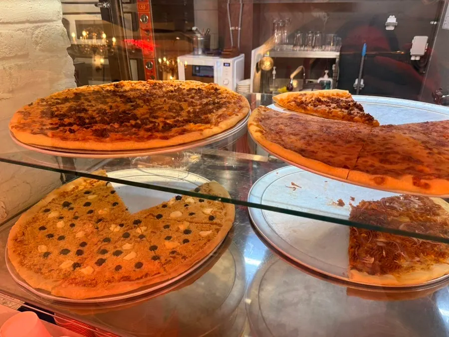 Menu listing showing slice pizza prices