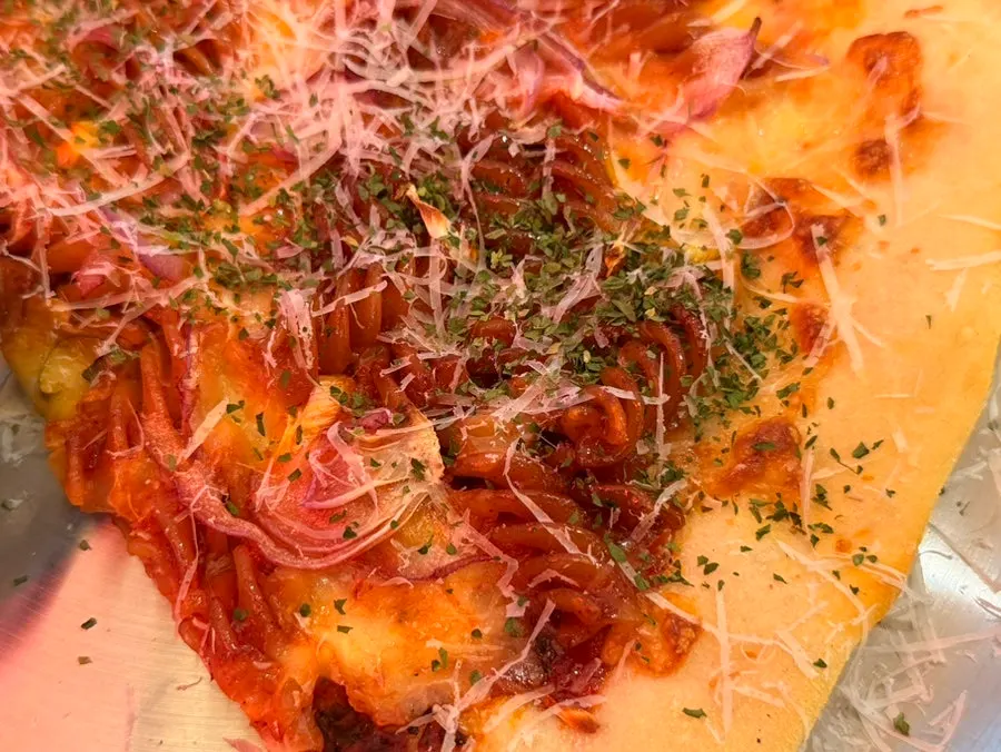 Slice of Big Spicy Fusilli pizza