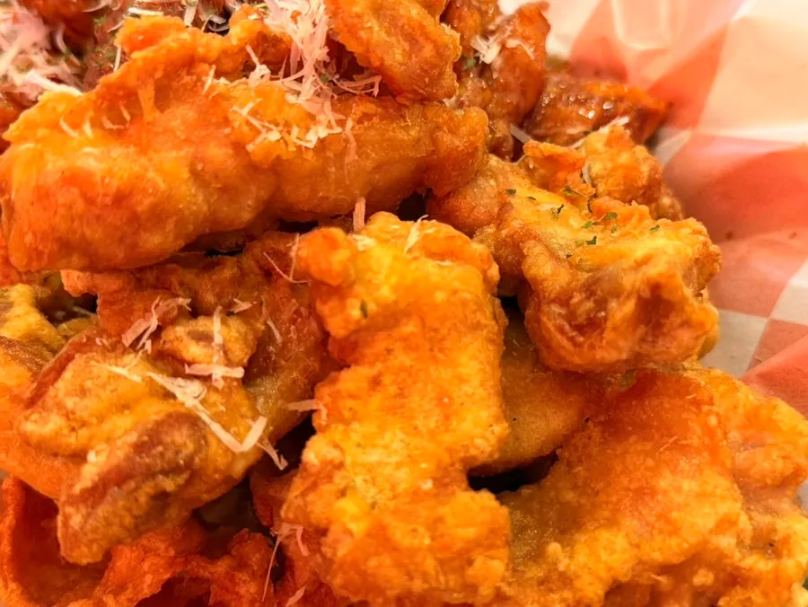 A piece of boneless chicken showing the meat inside