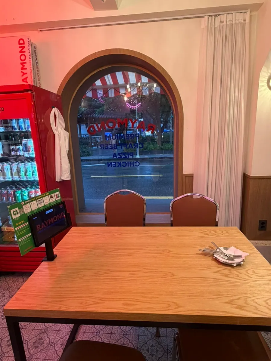Table and wall decor at Raymond Isu Branch