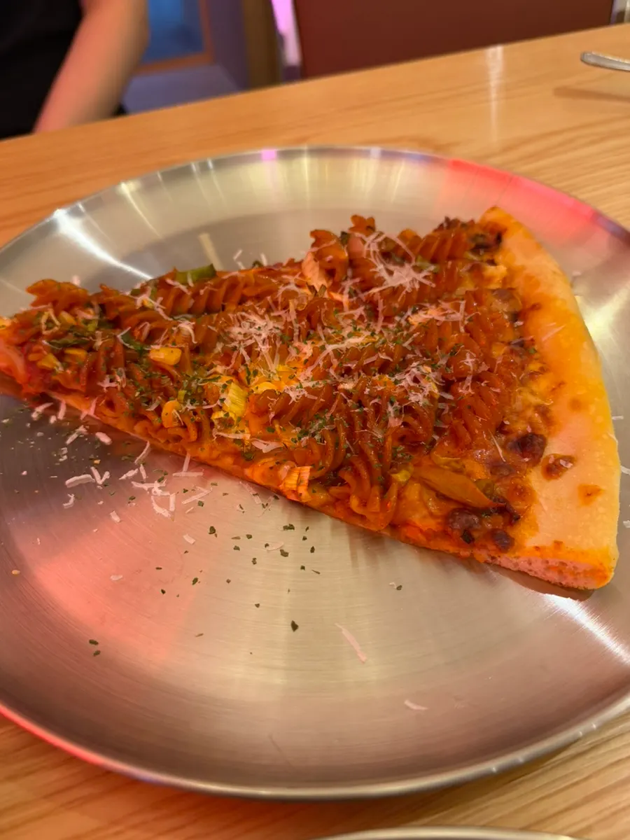 Big Spicy Fusilli Pizza topped with fusilli pasta