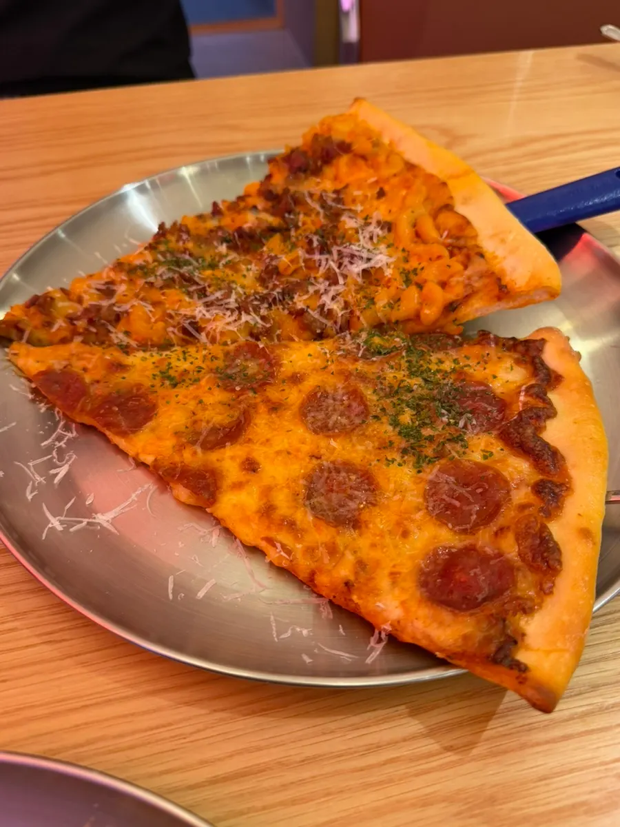 Slices of Mac & Cheese Pizza and Pepperoni Pizza