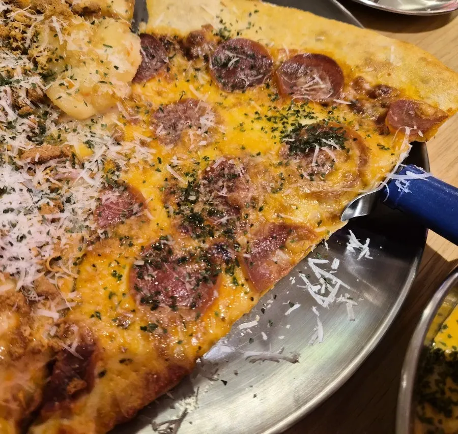 Slice pizza topped with Lotus cookie crumbles