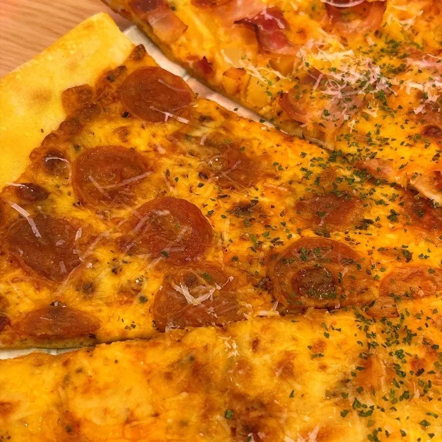 A slice of Big Cheese Pizza