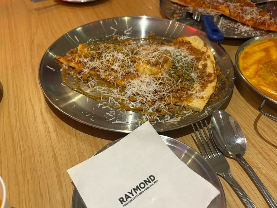 Spicy fusilli pizza topped with fusilli pasta