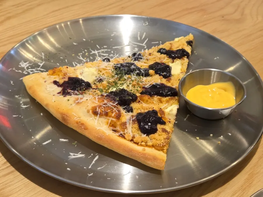 A palm-sized slice of pizza