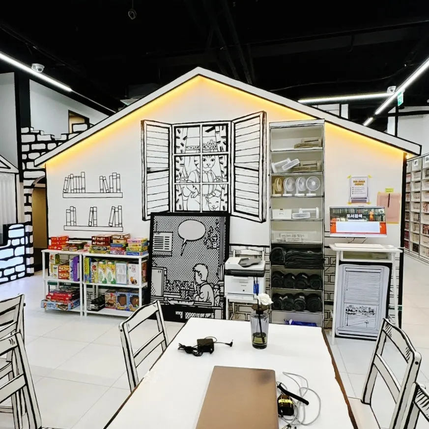 Real Toon Comic Café bookshelves organized by section
