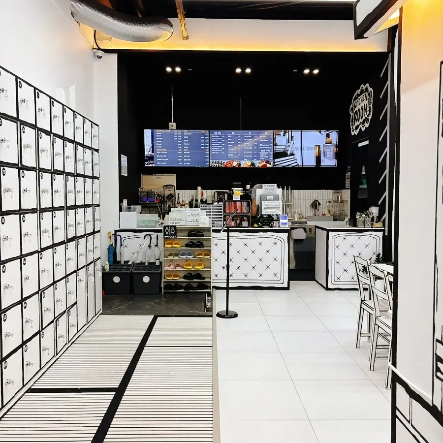 Closing shot of Real Toon Comic Café's black-and-white space
