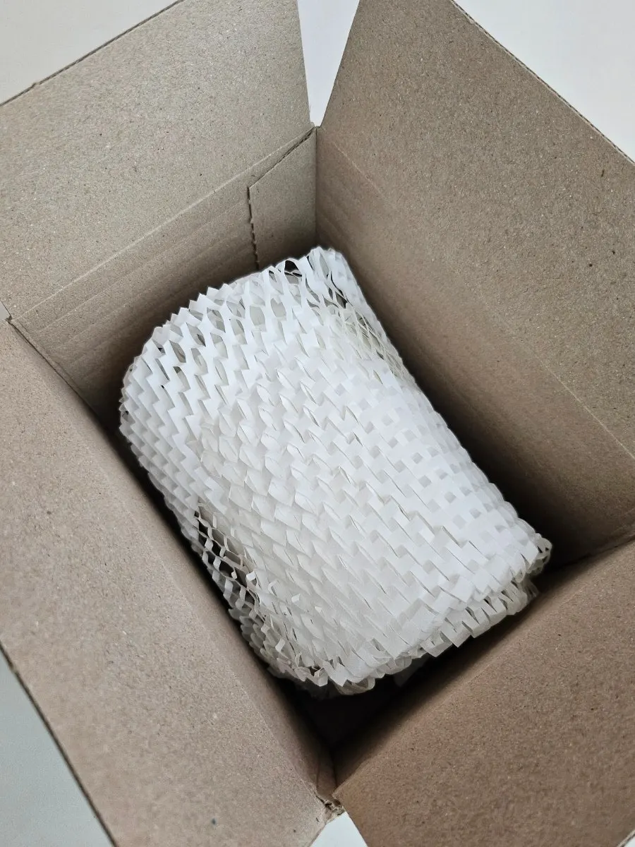 Opened delivery box showing Seed Soap packaging