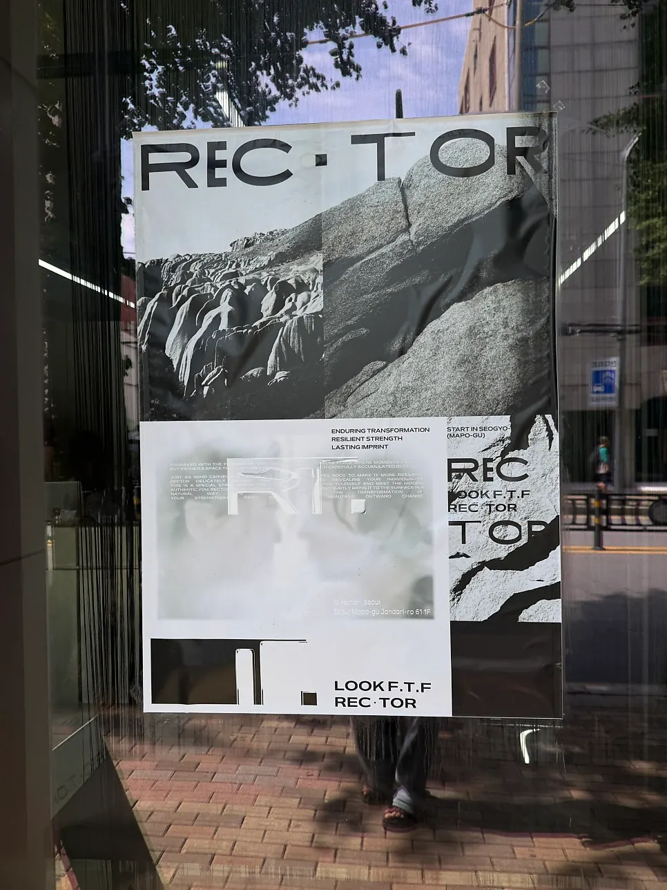 Entrance of Recteur Seoul with floor-to-ceiling windows and marble exterior