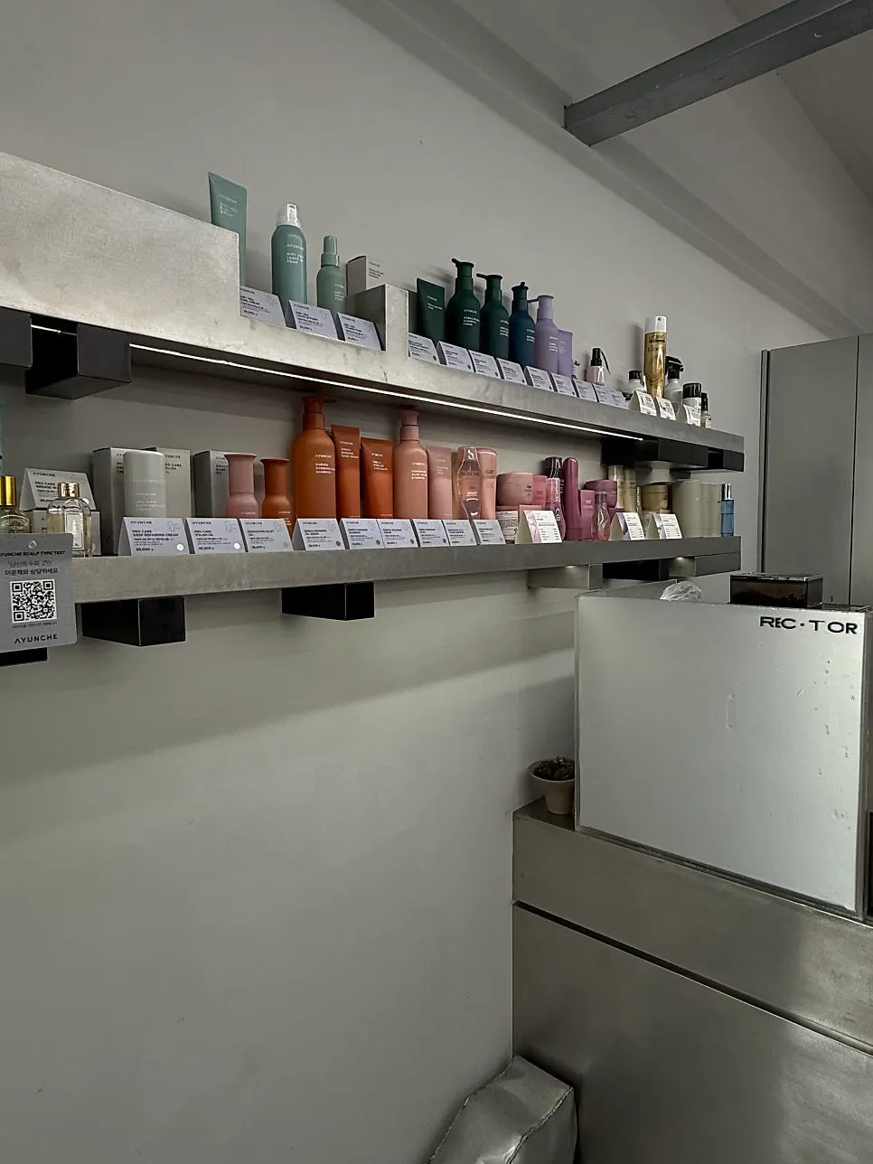 Salon interior with tall ceilings and silver-toned decor