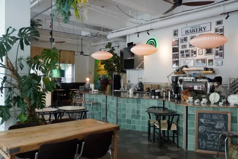 Reelbakers interior with plant styling and warm lighting