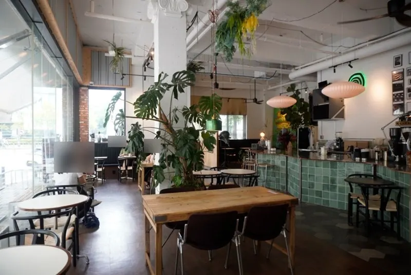 Reelbakers seating area with framed art and tables