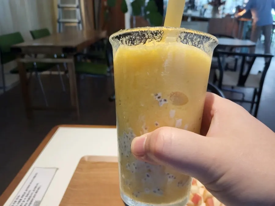 A glass of Reelbakers mango smoothie