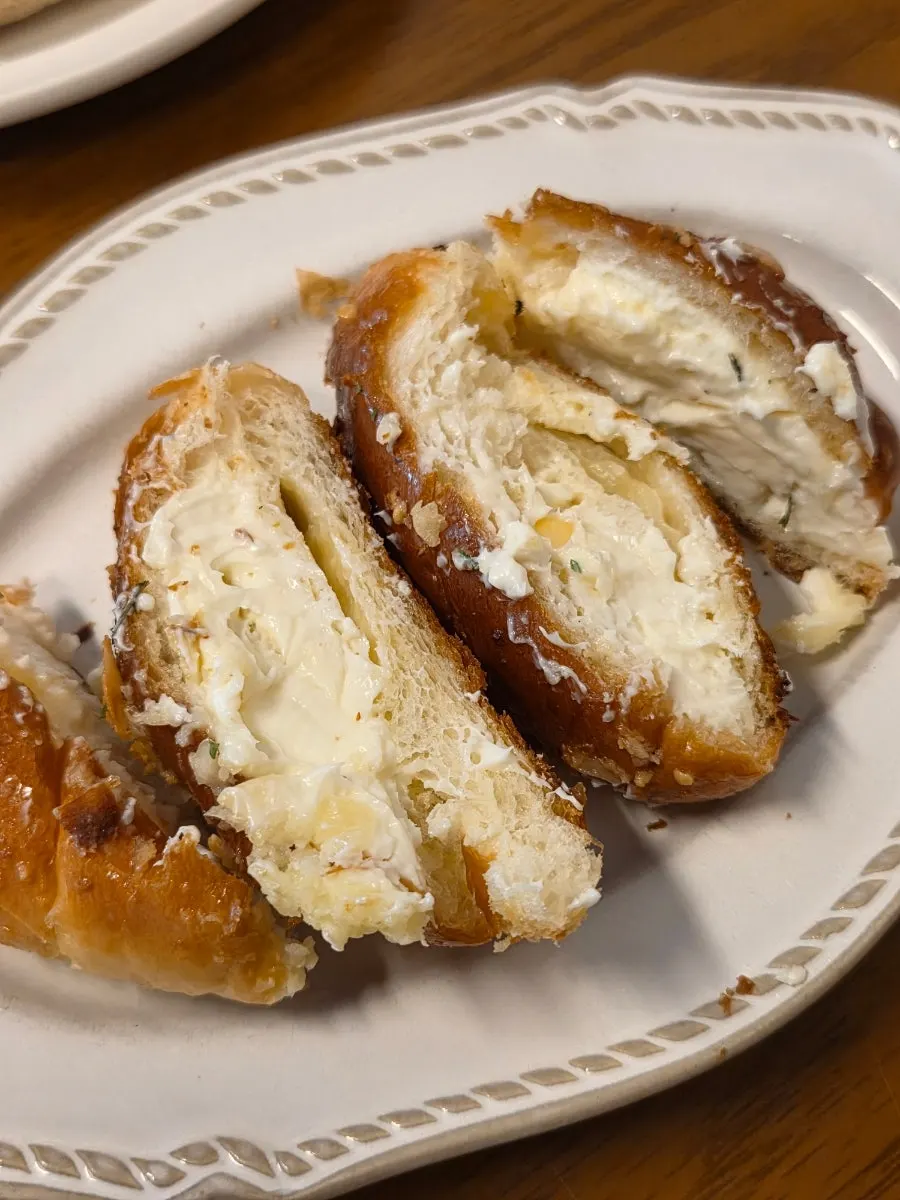 Cross-section of the garlic cream cheese salt bread showing the filling
