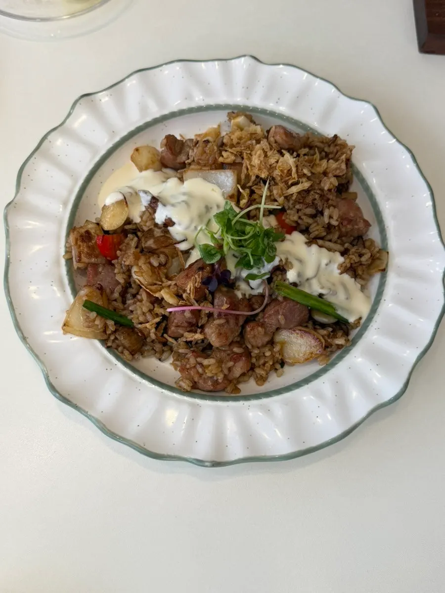 Fluffy stir-fried rice grains in the pork pilaf