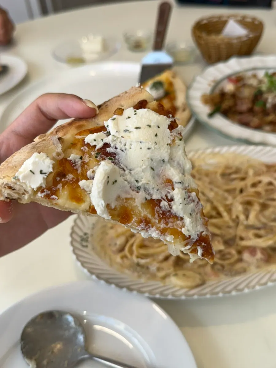 Cheese stretching from the quattro formaggi pizza