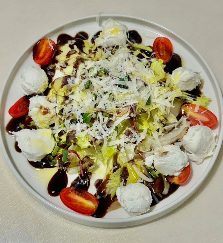 Resting07 salad topped with ricotta cheese