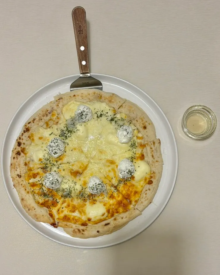 Quattro formaggi pizza topped with cheese