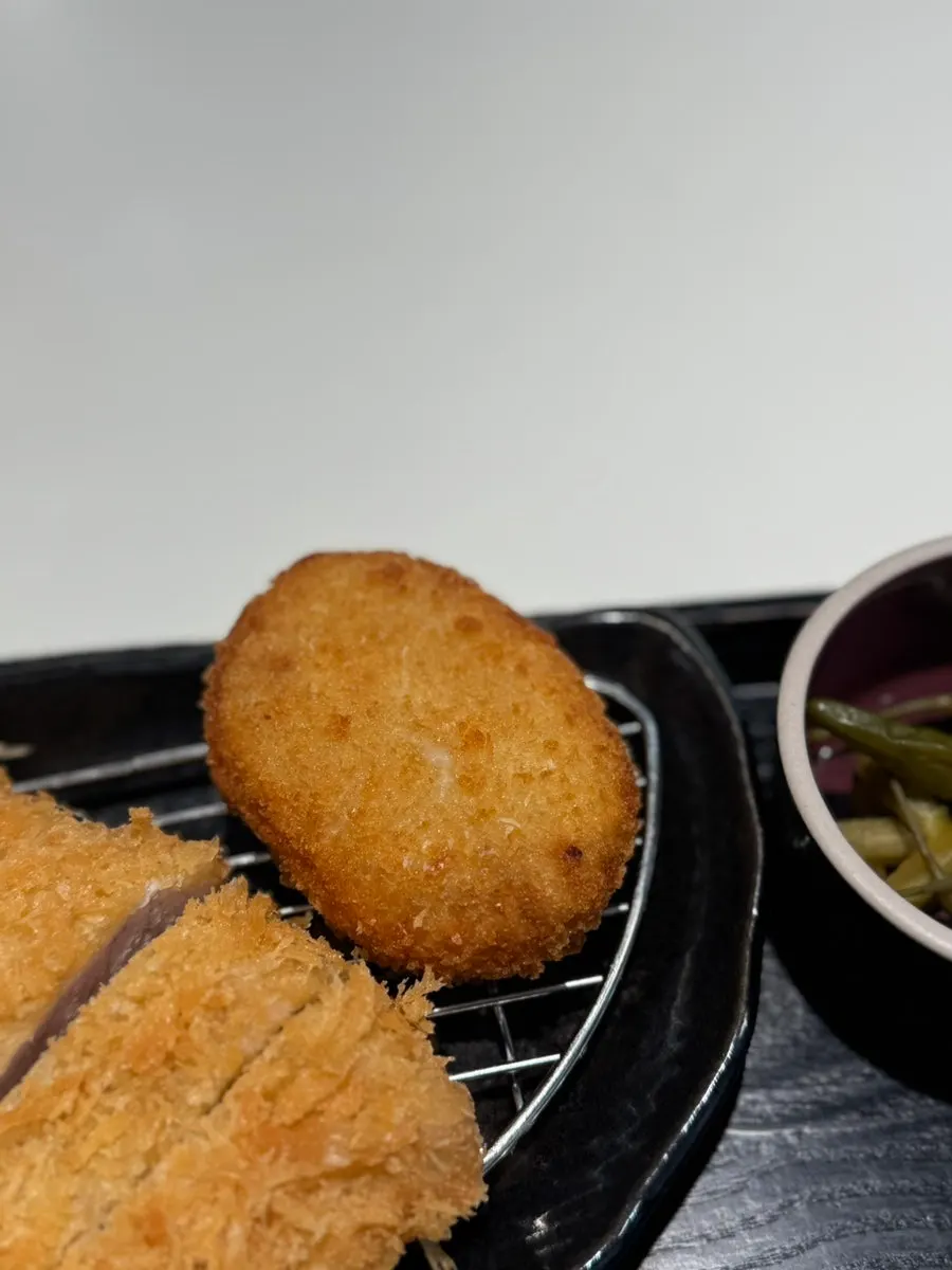 Small round flattened potato croquette