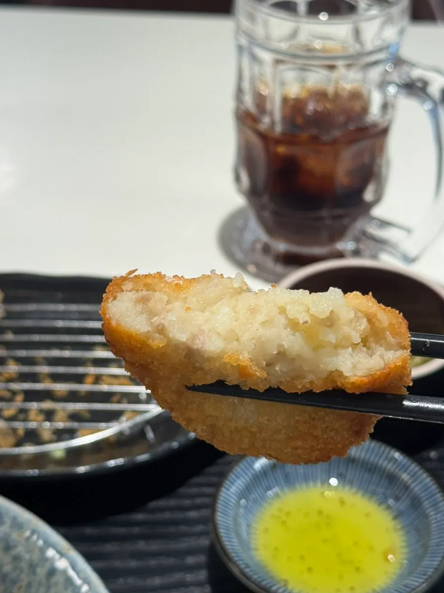 Cross-section of the croquette showing mashed potato