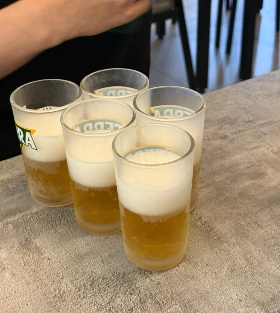 A glass of somaek soju-beer mix