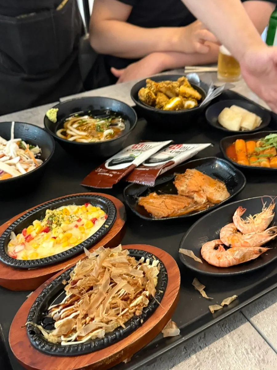 Base banchan spread served with the assorted sashimi order
