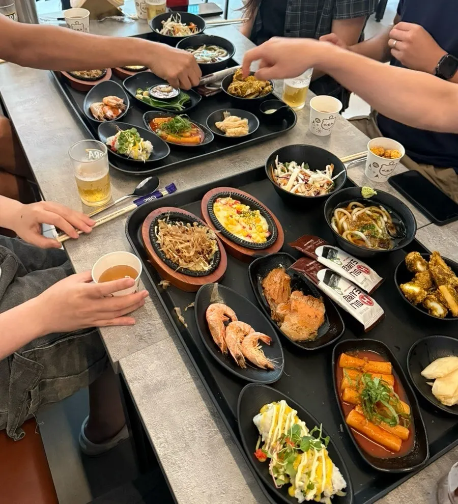 A table for six filled with banchan side dishes
