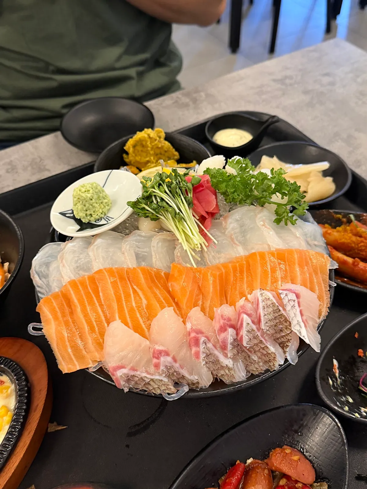 Aged sashimi platter garnished with water dropwort and vegetables