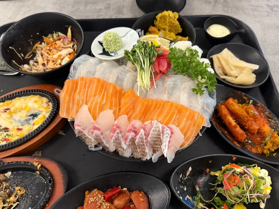 A piece of sashimi with fresh wasabi and vinegar sauce