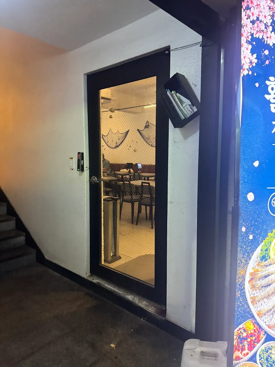 Blue, ocean-themed exterior of the Rigo Susan storefront