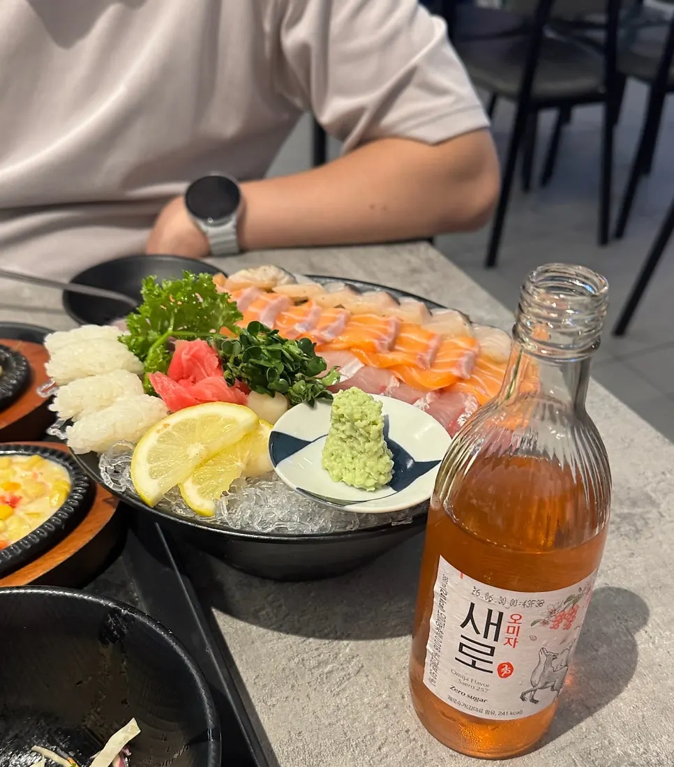 Glass of Saero Omija enjoyed alongside the sashimi combo