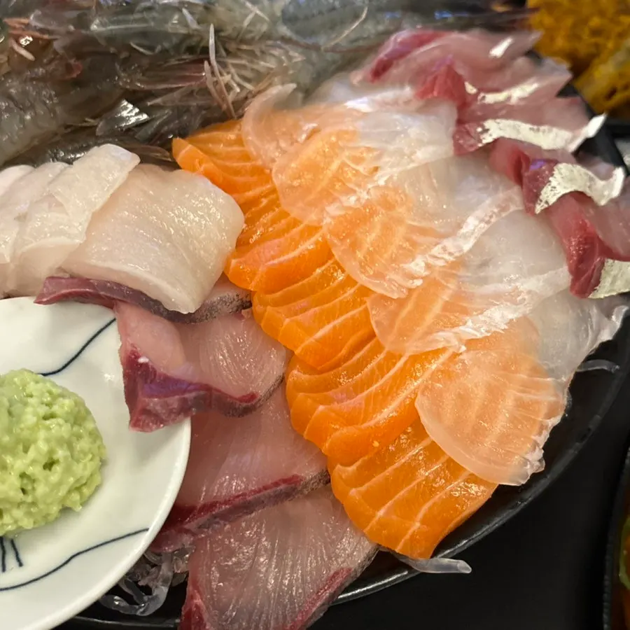 Medium mixed sashimi and raw shrimp platter ordered by three people