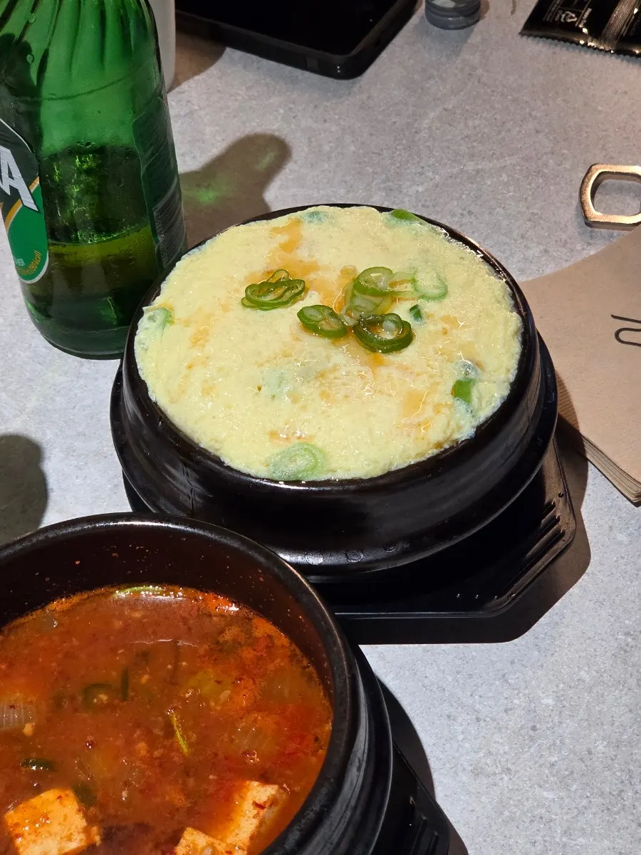 Complimentary steamed egg custard topped with sesame oil