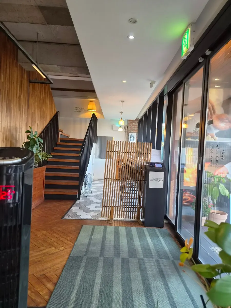 Outdoor area with the sea visible across the street