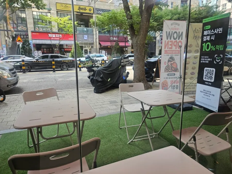 Table seating inside Roaster Burger