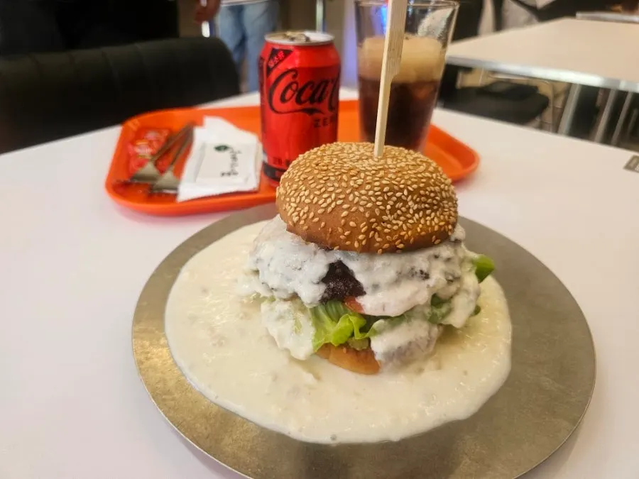 The white burger with its thick stacked patties