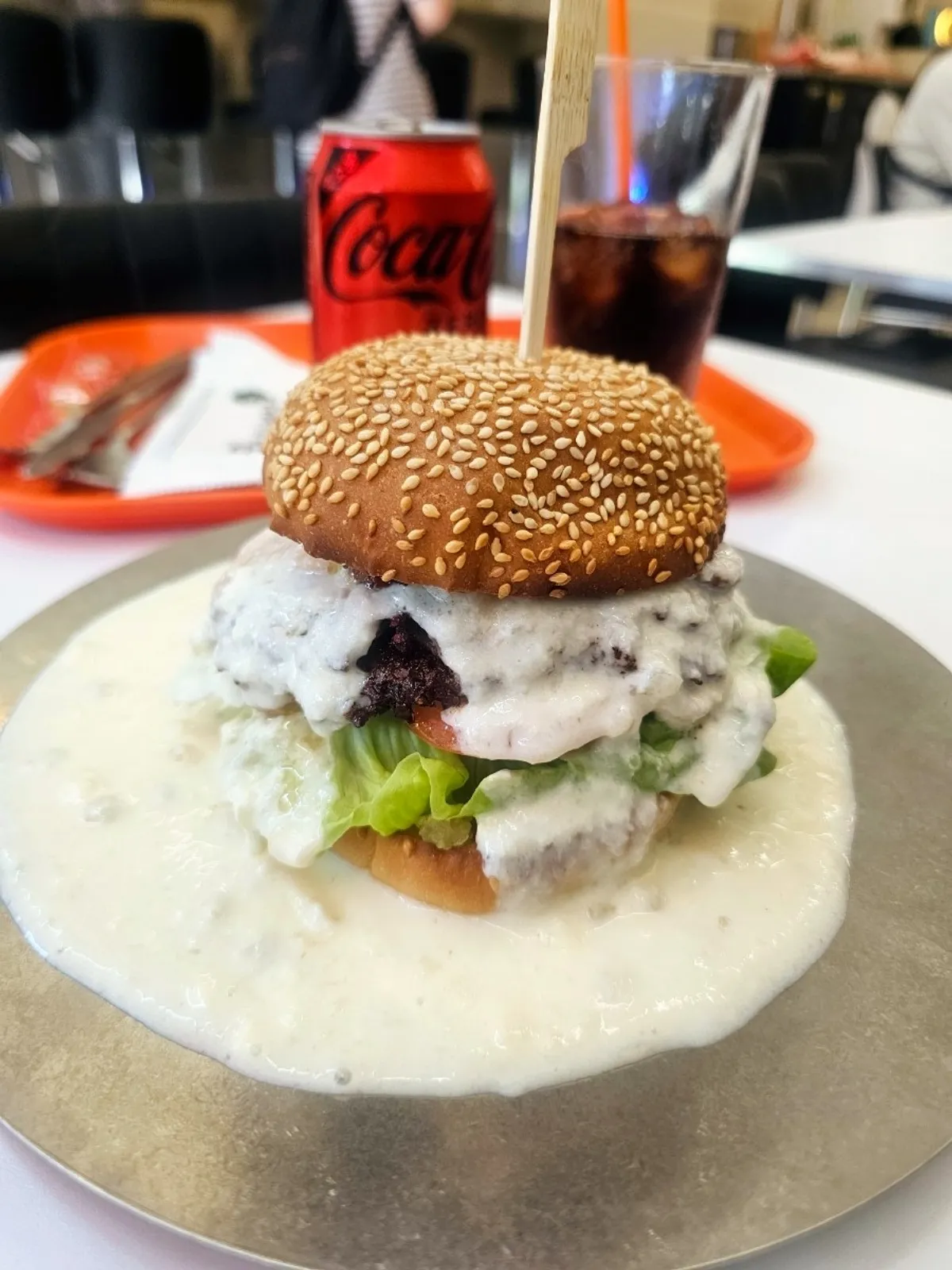 The white burger with white sauce and a double patty