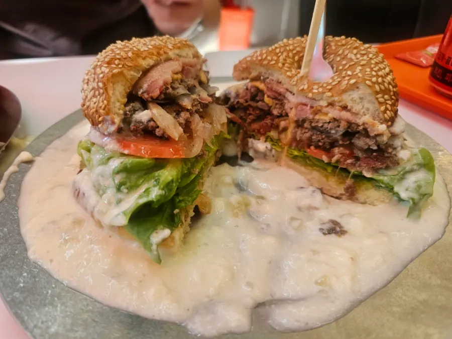 A table shot of Roaster Burger's burger and sides