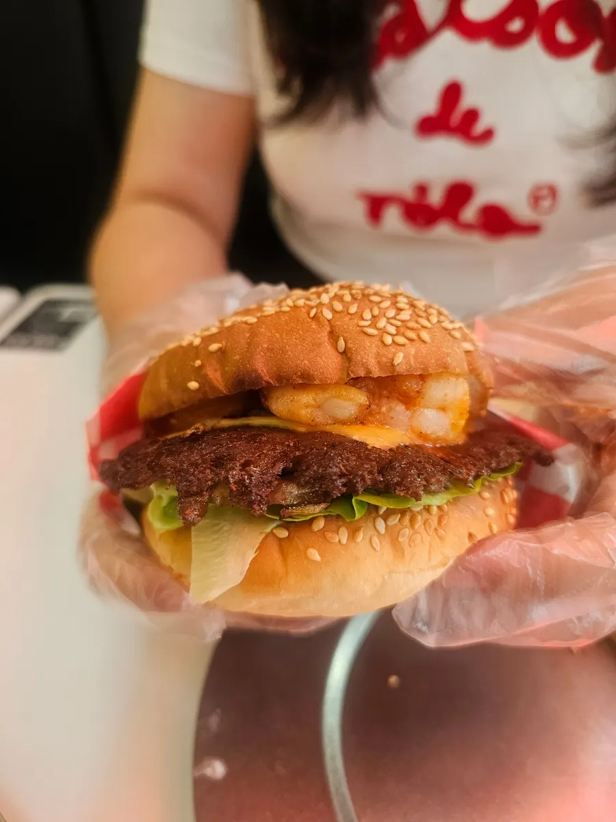 The whole shrimp beef burger with its spicy sauce added