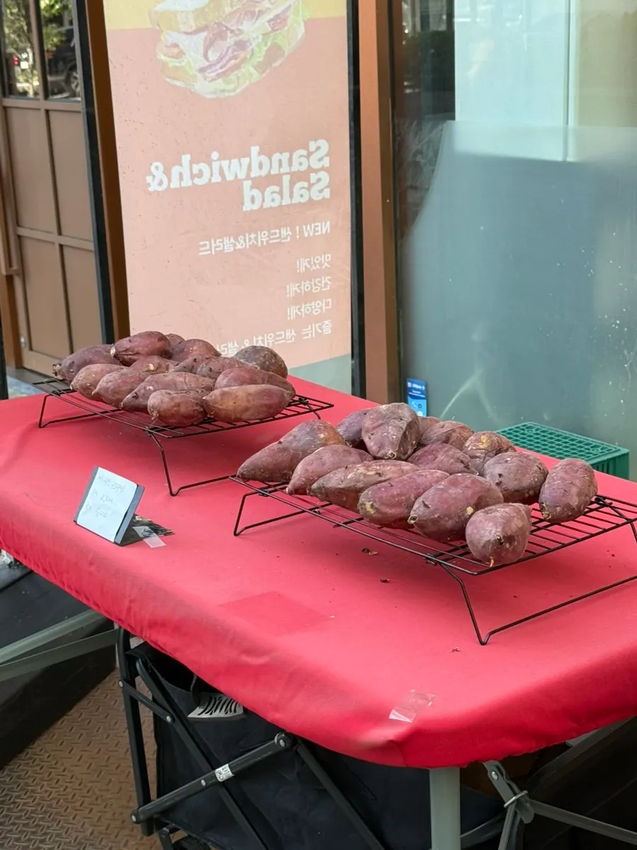 Roasted sweet potatoes sold outside the cafe