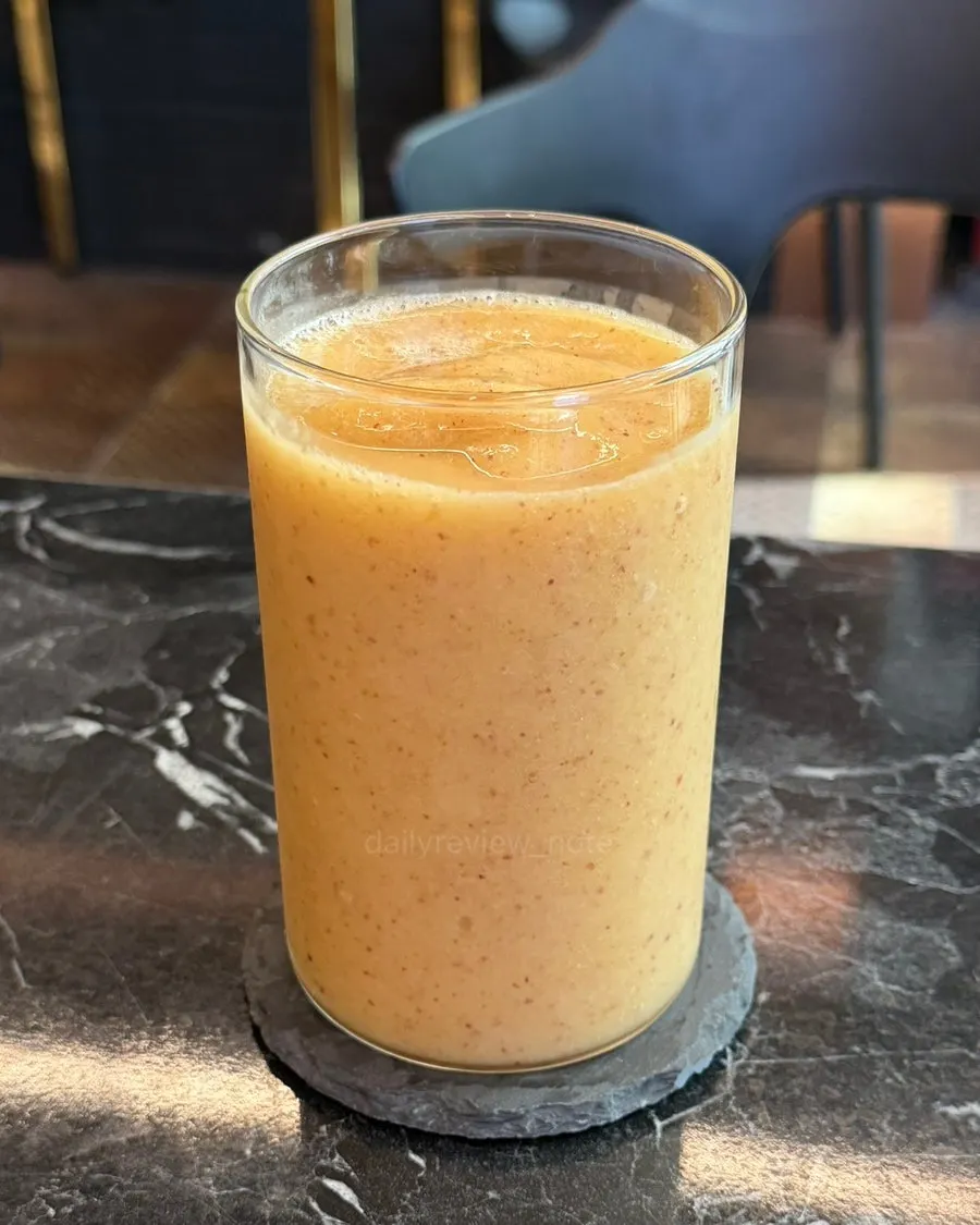 Fresh nectarine juice with a fleshy texture