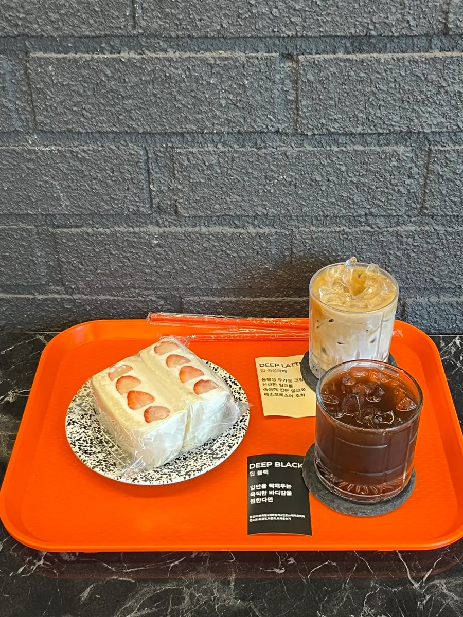 Café menu listing coffee and sando items