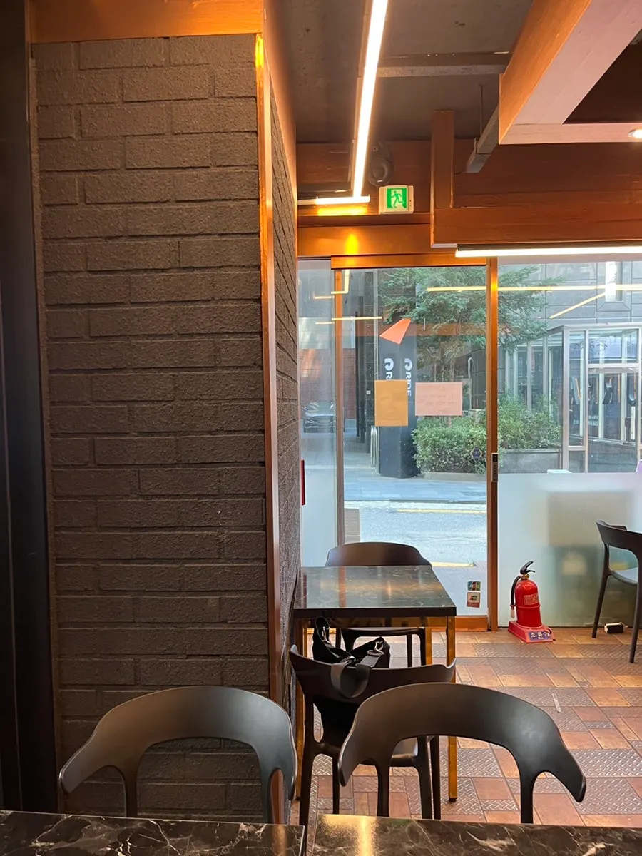 Black-and-orange toned café interior