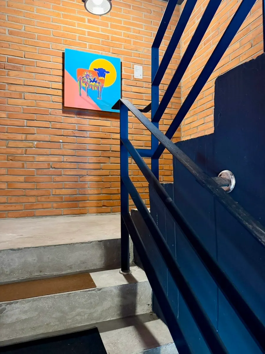 Stairs leading up to the 2nd floor beside the back door