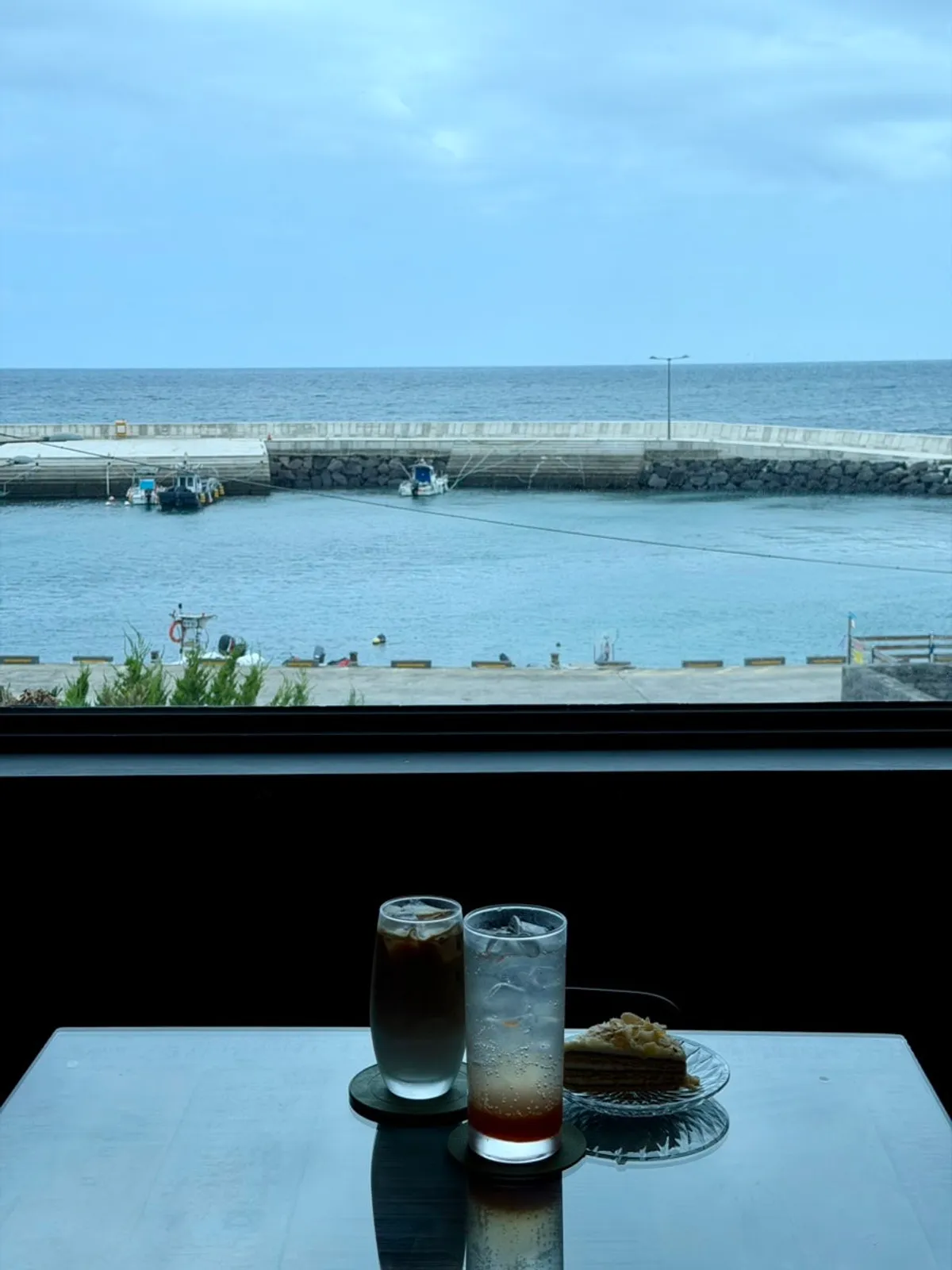 2nd floor room with a big window showing the ocean view