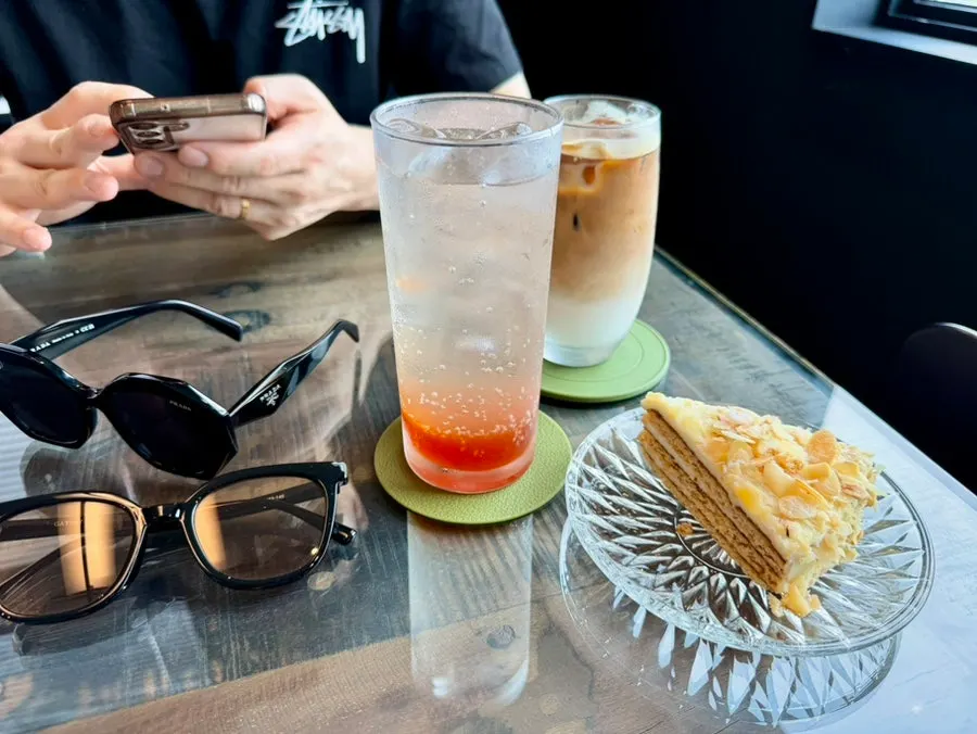 Almond malenka honey cake with an iced café latte and grapefruit honey ade