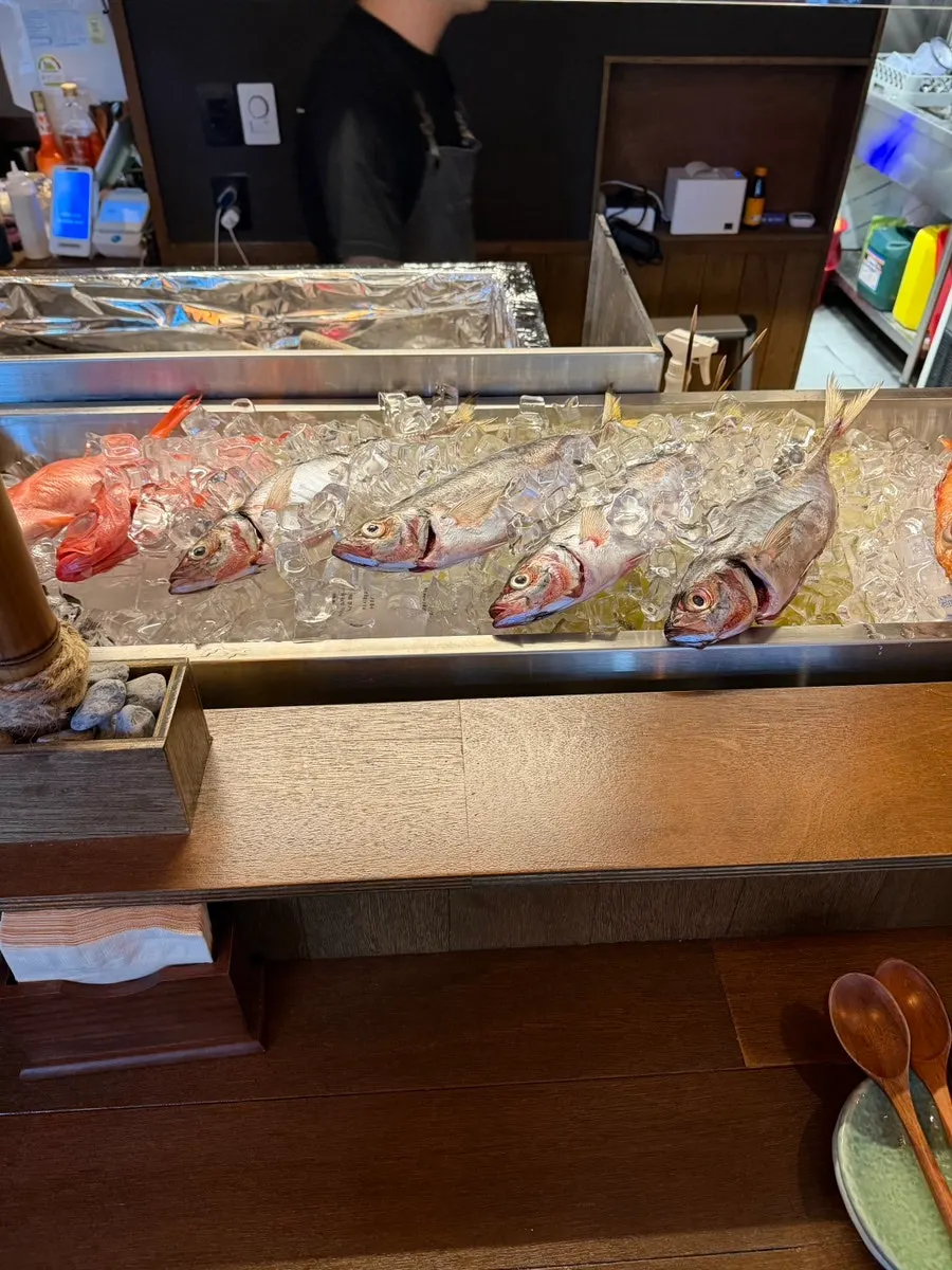 Counter seats overlooking the charcoal grill